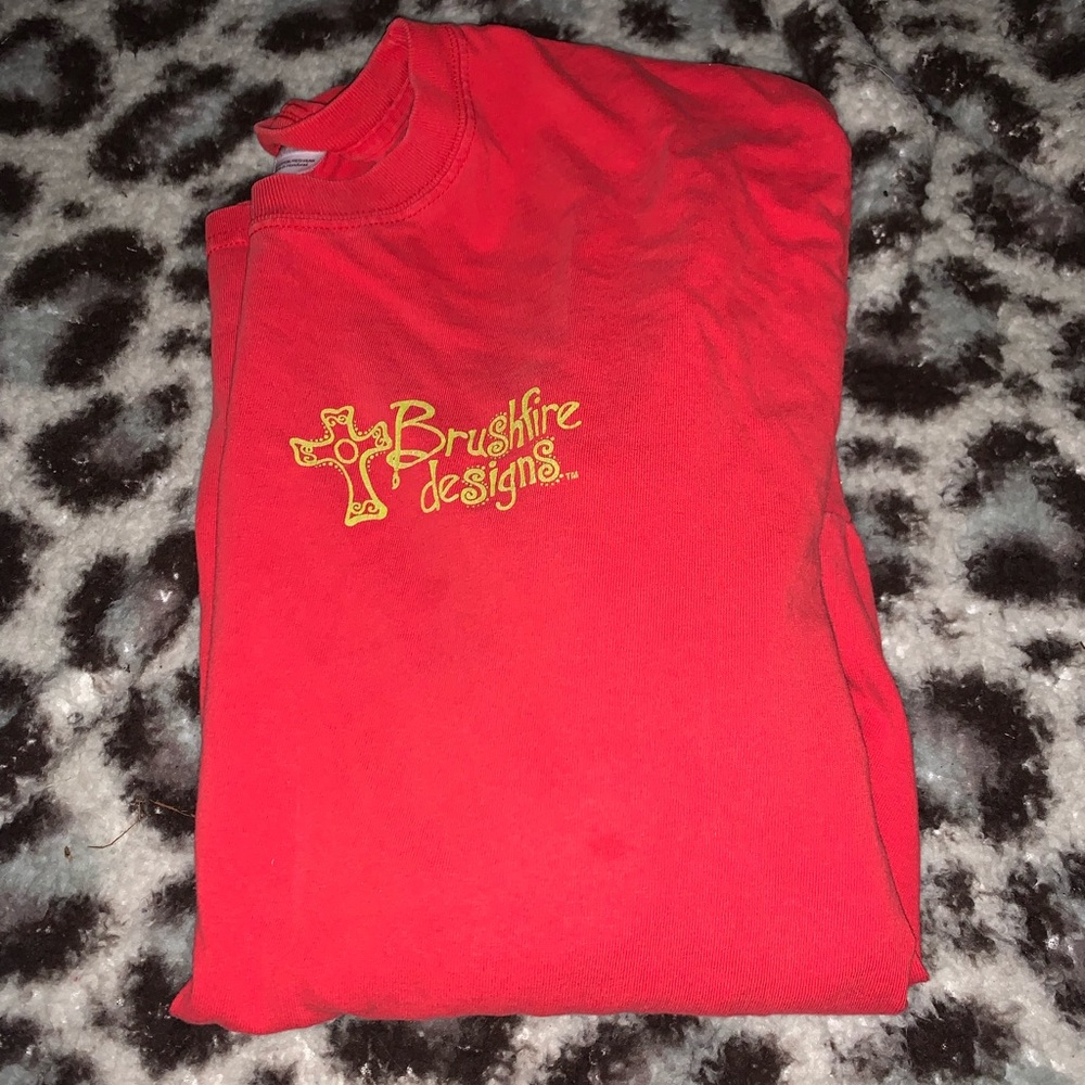 red cross t shirt with graphics. size large